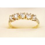 An 18 carat gold five stone diamond ring (total over 1.2 carats approx.)
