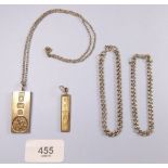 A 9 carat gold ingot (14g), a silver ingot, two silver bracelets and a necklace