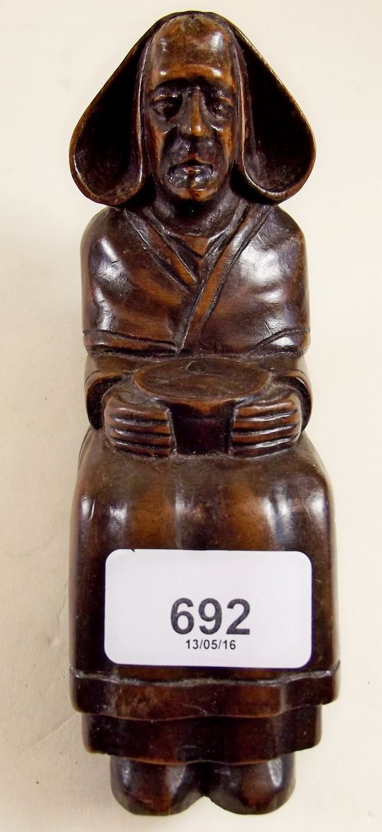 A 19th century continental carved wood seated figure