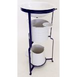 A painted metal washstand with enamel bowl and matched jug and bucket