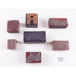 Two wall tiles printed veteran cars and seven copper and wood printing blocks