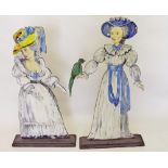 A pair of early 20th century cut out window display models of ladies - 1.7m tall