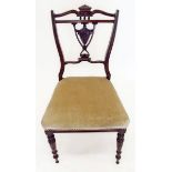 A Victorian salon chair with carved vase splat