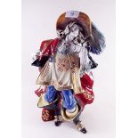 A large Capodimonte figure of a musketeer 35cm