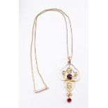 A 9 carat gold pendant set seed pearls and garnets on 9 carat gold chain