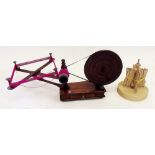 An antique mahogany and elm wool winder with later fruit wood repairs, complete and working plus a