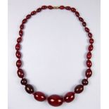 A string of dark red amber beads 50g