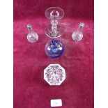 Two glass scent bottles, silver clad candlestick, a Waterford glass paperweight, blue glass vase