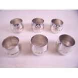 A set of six napkin rings monogrammed 7ozs