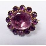 A Victorian amethyst brooch set in yellow metal