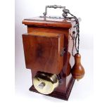 An Edwardian walnut cased waiting room bell from Osteopath's clinic