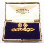 An Edwardian gold bar brooch set sapphire and two diamonds, boxed and a pair of earrings