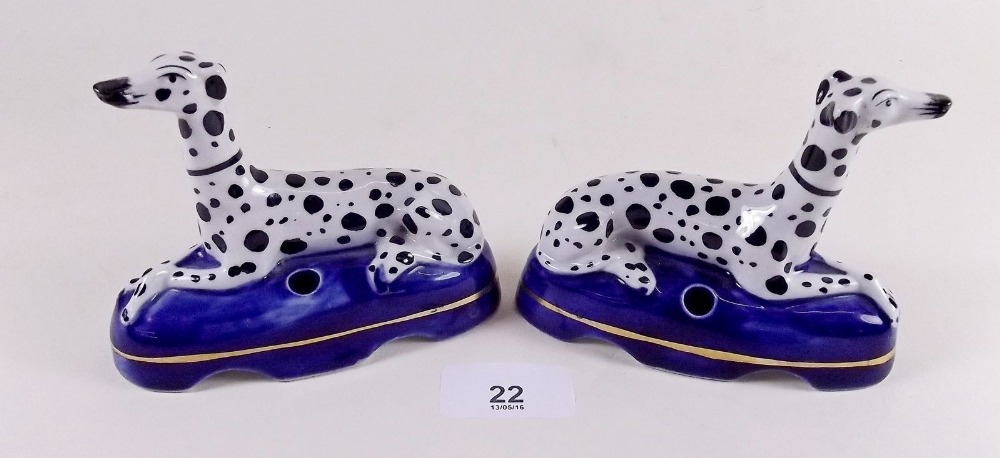 A pair of porcelain dalmatian pen holders