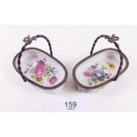 A pair of Limoges floral printed baskets with gilt metal mounts