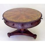 An early 19th century mahogany rosewood and brass inlaid rent table with gadrooned edge, the