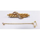 An Edwardian gold and diamond set bar brooch