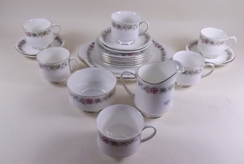 A Royal Albert tea service 'Belinda' comprising: six cups and saucers, cake plate, six tea plates,