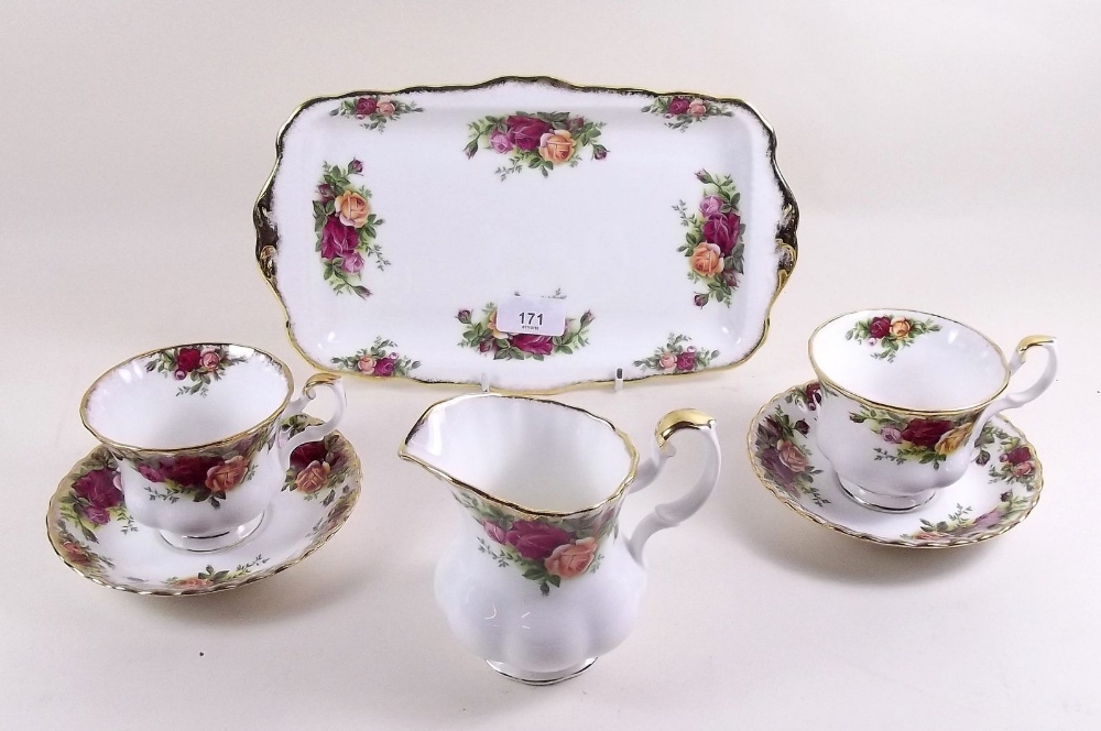 A Royal Albert Country Roses tea service comprising: eight cups and saucers, eight tea plates, two