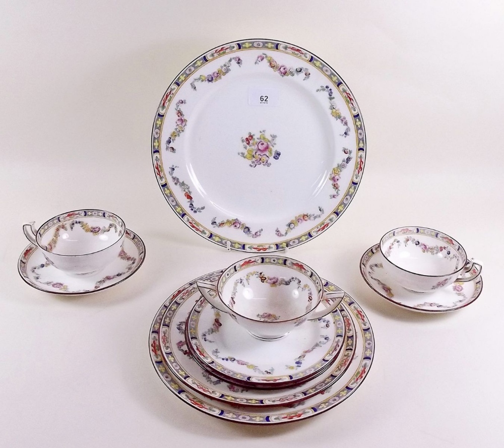 A Minton part tea service painted swags of flowers comprising: four cups and saucers, seven side