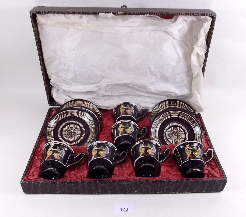 A Grecian coffee set with Etruscan style decoration comprising six cups and saucers in fitted case