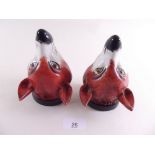 A pair of 19th century fox head form pottery stirrup cups, one a/f