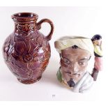 A large Royal Doulton character jug Othello and a brown glazed jug 'Sunflowers'