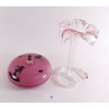 A glass pink powder bowl printed silhouettes of a girl and fairy dancing and glass flower form vase