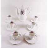 A Wedgwood Coniston coffee service comprising: coffee pot and six demi tasse cups and saucers