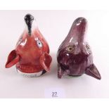 A Victorian Staffordshire fox head stirrup cup 'Talleo' and other dark red one (chip to rim)