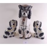 A pair of Staffordshire dogs and a spaniel form jug