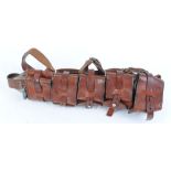 Leather magazine belt with four pouches, and another tooled leather belt