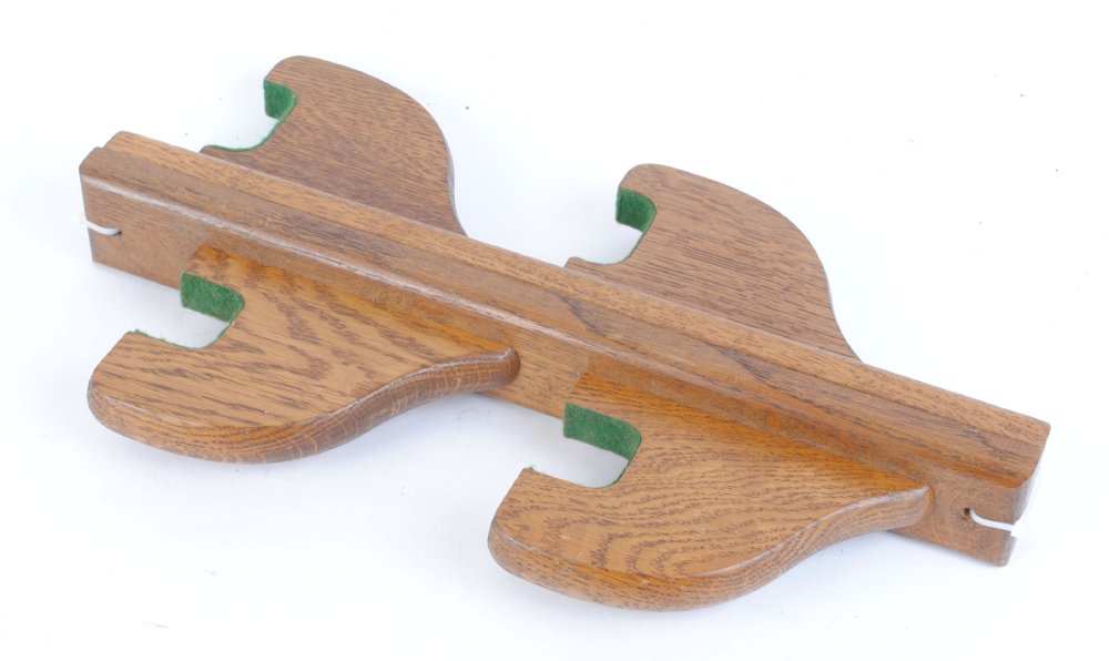 Pair of baize lined oak rests for two guns