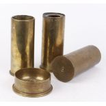 Three 74mm brass shell cases, 100mm Mk2 mortar shell base