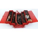 Expanding tool box with large quantity of gun parts including locks, actions, hammers, screws, etc.
