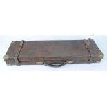 Oak and leather gun case with brass corners, fitted claret baize interior for 30 ins barrels and