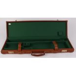 Italian tan leather motor case, green baize lined fitted interior for 30 ins barrels