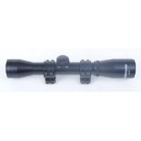 4 x 32 Bushmaster scope on 11mm roll off mounts