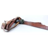 Two gun slips; 12 bore leather cartridge belt; pair Peltor ear defenders