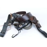 Three various leather western rigs with dummy rounds