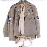 Two U.S. Army Corporal field uniforms (jackets and trousers)