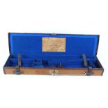 Canvas and leather gun case with keys and blue baize fitted interior for 30 ins barrels, with Army &
