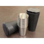 Two sets leather cased stainless steel drinking cup sets