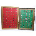 Two framed military cap and belt badge display boards, a total of 88 badges