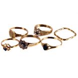 Six 9ct gold gem set rings,  including a sapphire and diamond flower cluster with ring, an