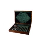 A ten piece electroplated fish service by Elkington & Co,  in a green silk lined oak canteen,