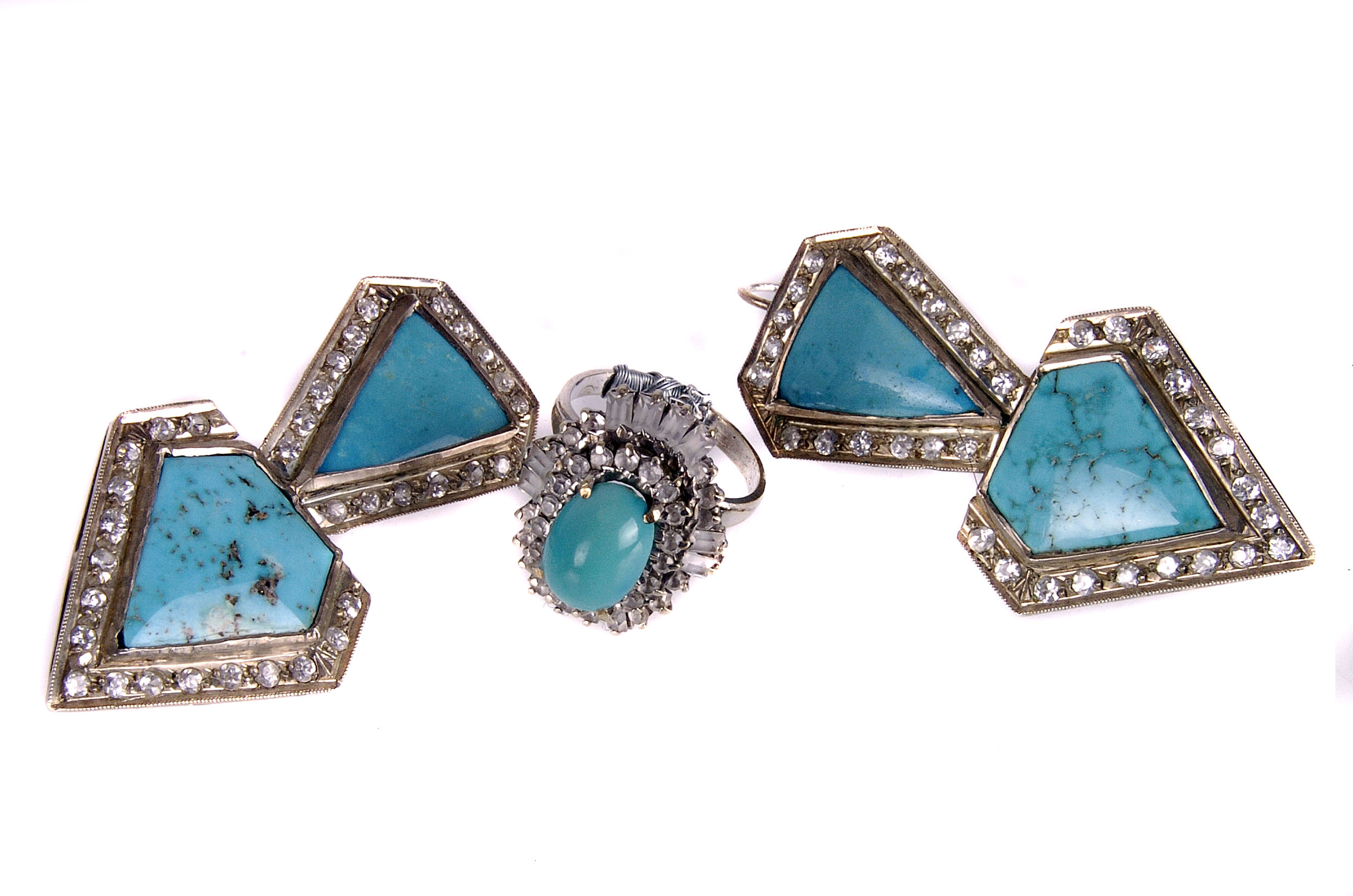 A pair of Middle Eastern turquoise and white sapphire earrings, the turquoise stones of spear head