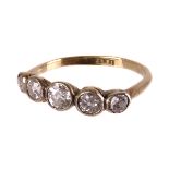 An early 20th century five stone diamond ring, the graduated spectacle set old stones totalling