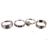 Three white gold gem set rings,  including a diamond and sapphire half hoop eternity ring in 9ct