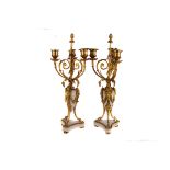 A pair of ormolu and marble three branch candelabra,  in the 18th century style, each with white