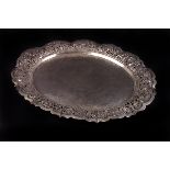 A Continental white metal oval tray,  with foliate pierced and scalloped edge, and hammered effect